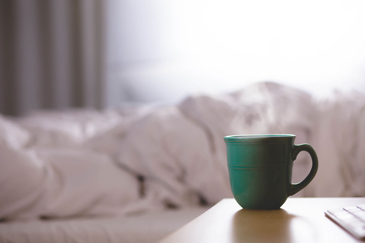 Mug on a bed side table